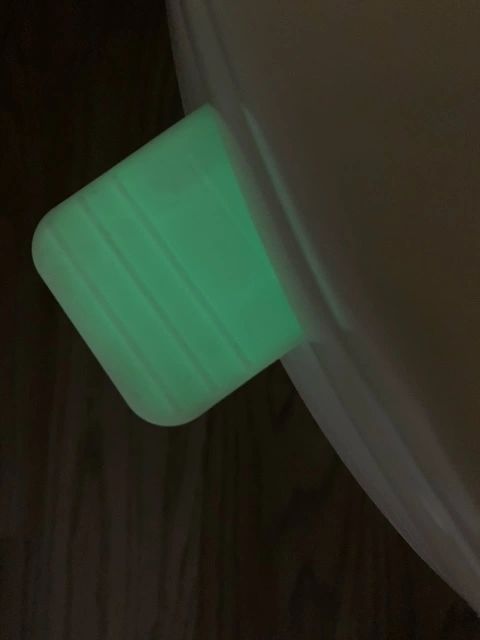 Glowing mint green handle dark background